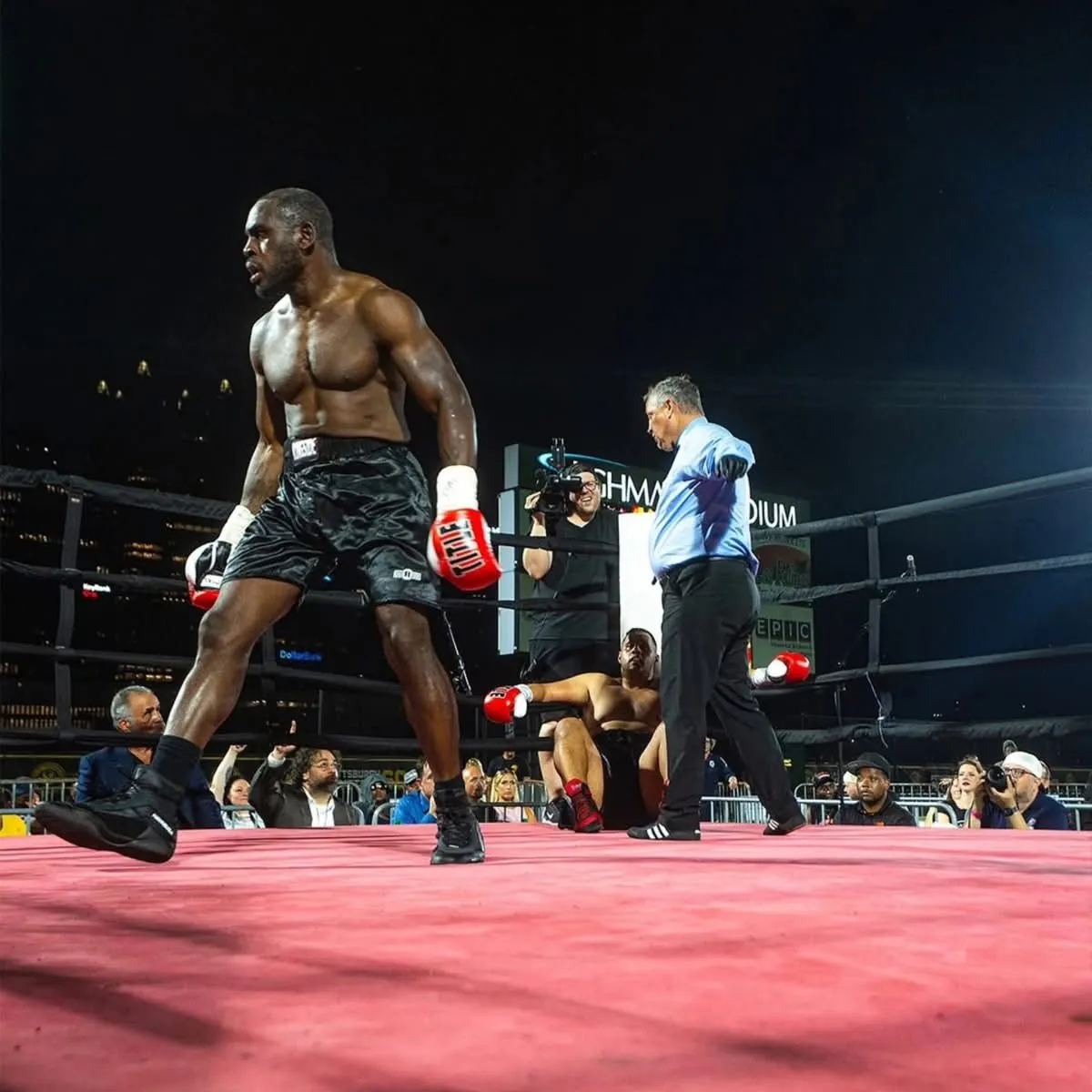Ed Latimore standing in the boxing ring after a knockout victory